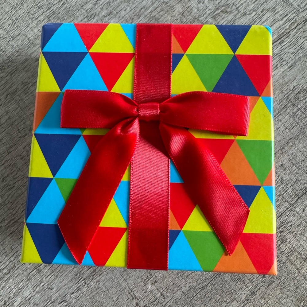 Colorful Geometric Gift Box with Red Ribbon